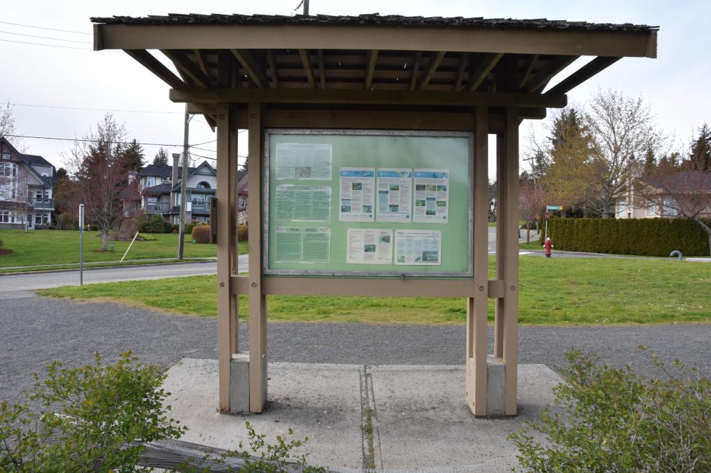 A covered bulletin board in a public park